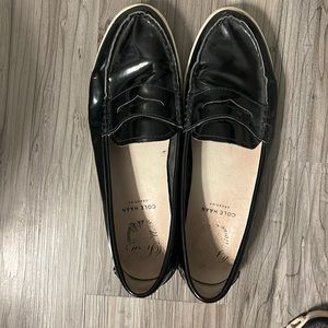 Black patent Cole Hank loafers.